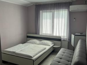 Postel nebo postele na pokoji v ubytování Guest House MAX