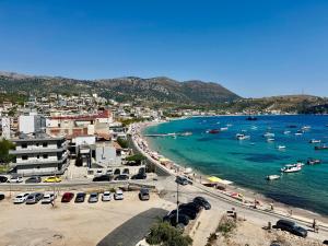 a view of a beach with boats in the water at Peter's Sea House in Himare