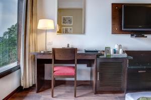 TV a/nebo společenská místnost v ubytování Amber Inn by Orion Hotels