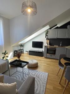 a living room with a couch and a table at Luna Apartments Estonia in Tallinn