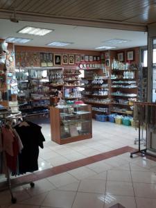 a store filled with lots of different types of shoes at Hôtel Estival Arriel in Lourdes