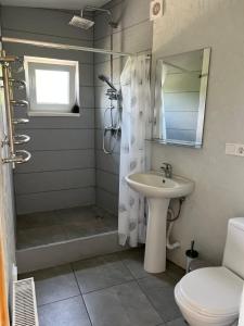 a bathroom with a sink and a shower and a toilet at Апартаменты в 5 минутах от моря, пляж Черноморка, Одесса in Odesa +24 photos