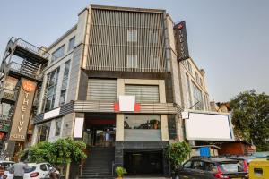 a building with a billboard in front of it at The IVY Grand Hotel - 5 Minutes from Connaught Place and New Delhi Railway Station With Free Secured Parking in New Delhi