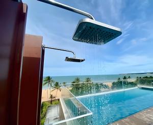a view of a swimming pool from a house at Flat à beira-mar Infinity at the Sea - MyFlats Hospedagens in João Pessoa