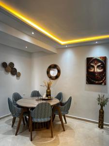 a dining room with a table and chairs at Stunning Modern Apartment in heart of Agadir for families in Agadir