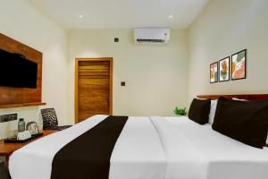 Voodi või voodid majutusasutuse Hotel O Ananthpur Formerly TR Residency toas