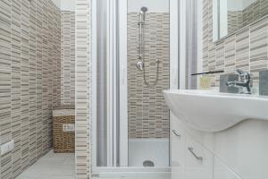 a bathroom with a sink and a shower at Villa Ada in Golfo Aranci +15 photos