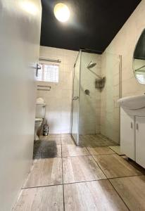 a bathroom with a shower and a toilet at 13 Orion Aparment in Polokwane