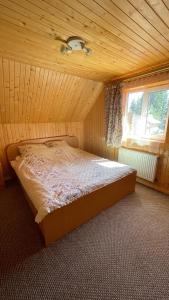 Postel nebo postele na pokoji v ubytování Mini Cottage