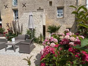 Aed väljaspool majutusasutust Chambres d’hôtes de l’Ancienne Auberge