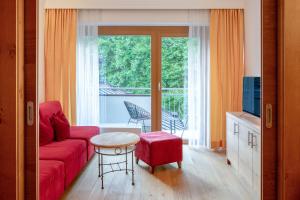 TV a/nebo společenská místnost v ubytování Familotel Amiamo