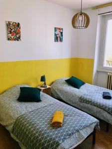 Ένα ή περισσότερα κρεβάτια σε δωμάτιο στο Gîte Les Embruns De Portsall - 5 P