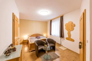 Posteľ alebo postele v izbe v ubytovaní Weingut - Gästezimmer zum Schwalbennest