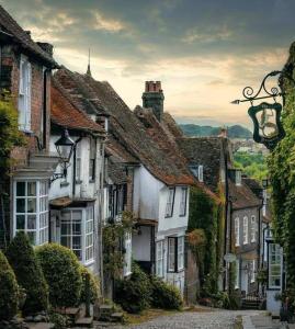 a group of houses on a cobblestone street at Seaside Escape - Parkdean Resort Camber Sands in Camber
