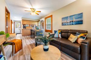 a living room with a couch and a table at Fishing Kayaks Firepit Paddleboat in Pierceton