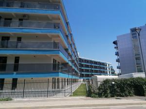 a tall building with a fence in front of it at Studio Andrew in Saturn