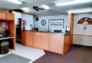 an office with a cashier counter in a room at Guardian Inn in Le Center