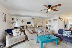 a living room with two couches and a ceiling fan at Bethany Marina --- 38249 Yacht Basin Rd #22 in Ocean View
