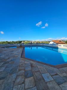 a swimming pool on the roof of a building at Piemont Flat Apart in Serra Negra