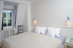 Postel nebo postele na pokoji v ubytování Galerie Suites