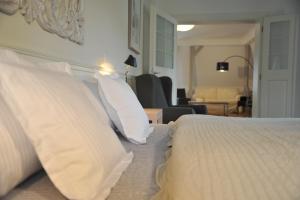 Posteľ alebo postele v izbe v ubytovaní Galerie Suites