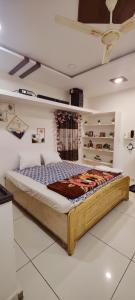 a bedroom with a large bed in a room at Krishna Residency in Hyderabad