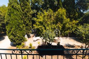 a park with a bench and some trees at Borgo Castello Sidra GG in Artena