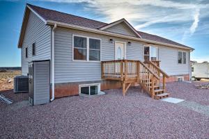 a house with a large deck on the side of it at Desert Retreat Basecamp for Zion, Bryce and Grand Canyon in Kanab