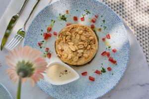 a blue plate with a cookie with nuts on it at Icce Borbirtok - Wine, Dine & Rest in Monoszló +30 photos