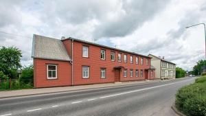 a red building on the side of a street at Ruumikas looduslik pärl- Self check-in in Viljandi