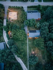 an overhead view of a yard with a house and trees at Przystanek Roztocze- leśne SPA, Jacuzzi & sauna in Susiec