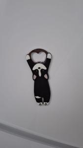 a black bird decoration on a white wall at McShane Studio 1 - Parking in Dudu +22 photos