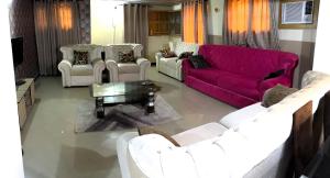 Posezení v ubytování Tripplejoy Suites