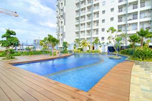 a swimming pool in the middle of a building at 1BR Citra Plaza Nagoya A2812 City and Sea View in Jodoh