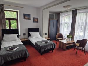 Posteľ alebo postele v izbe v ubytovaní Apartamenty Amadeus