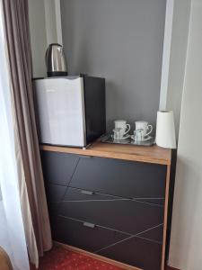 Kuchyňa alebo kuchynka v ubytovaní Apartamenty Amadeus