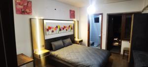 a bedroom with a bed and a mirror on the wall at Pamuklife Hotel in Pamukkale