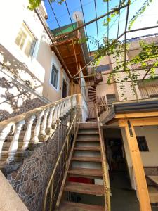 a set of stairs leading up to a building at Uncle house in Shkodër