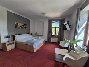 Posteľ alebo postele v izbe v ubytovaní Apartamenty Amadeus