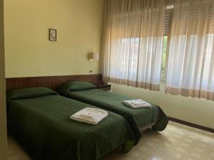 Postel nebo postele na pokoji v ubytování Hotel Matei Fiuggi