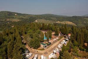 an aerial view of a parking lot in a forest at Camping Village Panoramico Fiesole in Fiesole