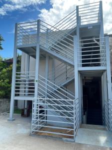 a staircase on the side of a building at Encanto da Praia hotel pousada in Natal