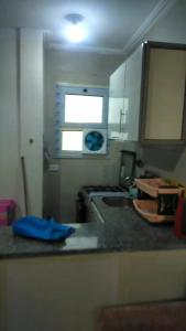 a kitchen with a sink and a window at VIP Chalet at JULIANA North coast جوليانا الساحل الشمالي in Dawwār Muşādif Yūnus