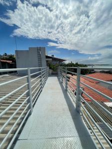 a walkway on the roof of a building at Encanto da Praia hotel pousada in Natal