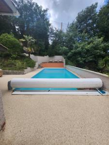 a swimming pool in a yard with at Villa Piscine près Golf Arcachon in La Teste-de-Buch