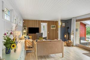 a living room with a couch and a table at 1111-Stege-Ulvshalevej-111 in Stege