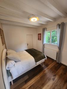 a bedroom with a bed and a window at Villa Piscine près Golf Arcachon in La Teste-de-Buch +23 photos
