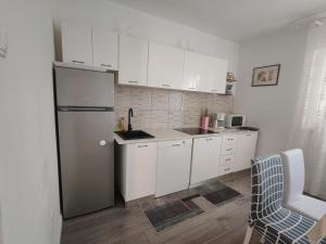 Kuchyň nebo kuchyňský kout v ubytování Apartment Lucia