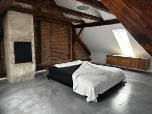 a bedroom with a bed and a television in it at U3 Loft in Varaždin