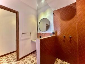 a bathroom with a shower and a mirror at Masaya Cartagena in Cartagena de Indias